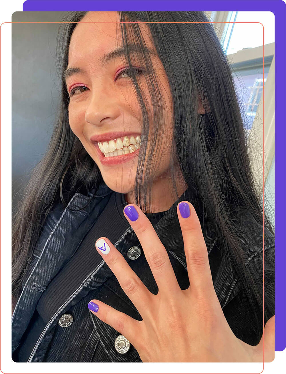 Team member showing her nails painted with AttackIQ colors